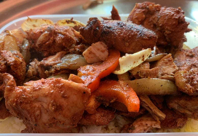 lady enjoying her wrap by the watford stall
